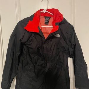 GUC Boys North face Black jacket with Red/orange liner and hood. Size L (14-16)